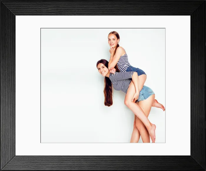 Framed Print : two cute teenagers having fun together isolated on white, girls friends Framed Print : two cute teenagers having fun together isolated on white, girls friends