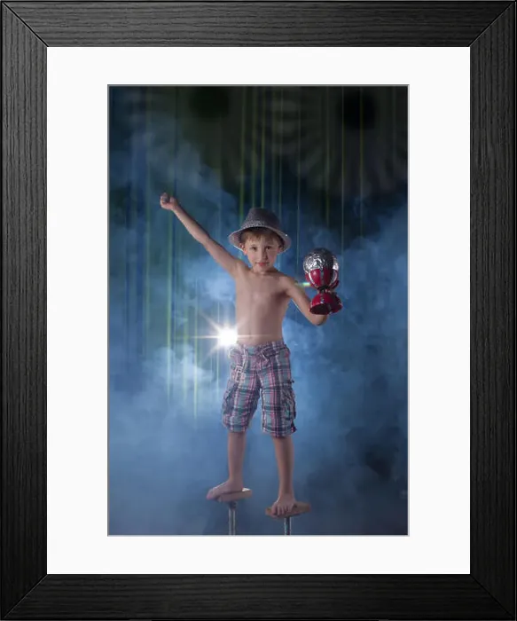 Framed Print : Little boy circus artist on stage. Circus kids. Performs child acrobat. Training a little juggler Framed Print : Little boy circus artist on stage. Circus kids. Performs child acrobat. Training a little juggler