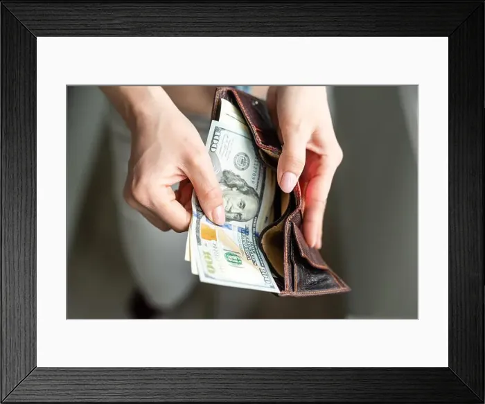 Framed Print : Rich woman taking from purse money Framed Print : Rich woman taking from purse money