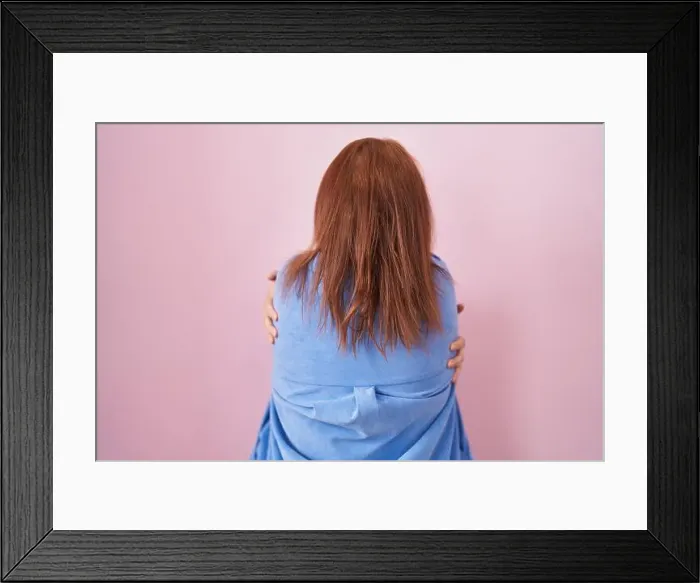Framed Print : Young hispanic woman with red hair standing over pink background hugging oneself happy and positive from backwards Framed Print : Young hispanic woman with red hair standing over pink background hugging oneself happy and positive from backwards