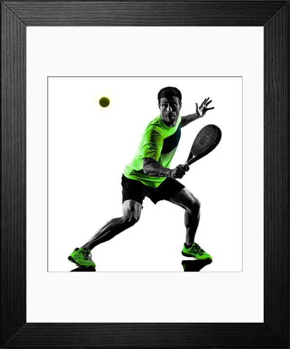 Framed Print : one caucasian man playing Paddle tennis player isolated on white background Framed Print : one caucasian man playing Paddle tennis player isolated on white background