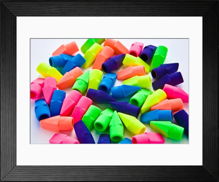 Framed Print : Pile of multi-colored pencil erasers on white background Framed Print : Pile of multi-colored pencil erasers on white background