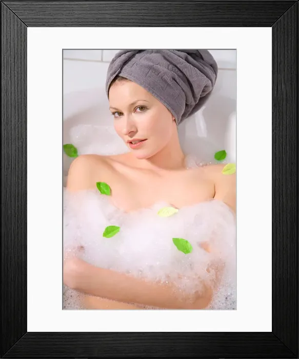 Framed Print : Young woman taking a bubble bath, portrait, close-up Framed Print : Young woman taking a bubble bath, portrait, close-up