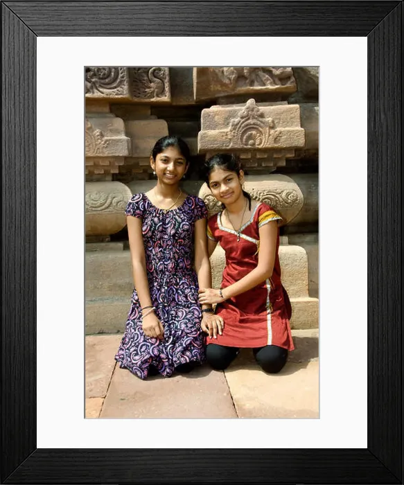 Framed Print : Two smiling sisters sitting at the backdrop of temple at Pattadakal in Bagalkot district, Karnataka, India, Asia Framed Print : Two smiling sisters sitting at the backdrop of temple at Pattadakal in Bagalkot district, Karnataka, India, Asia