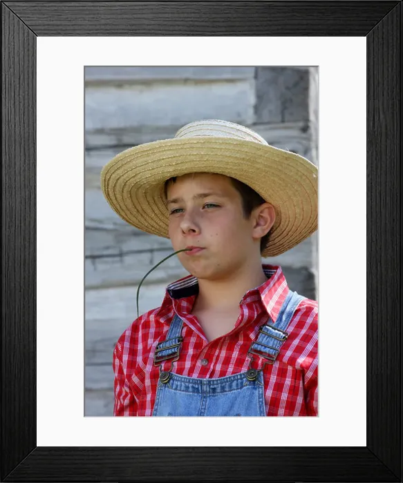 Framed Print : A farmer boy chewing on a blade of grass Framed Print : A farmer boy chewing on a blade of grass