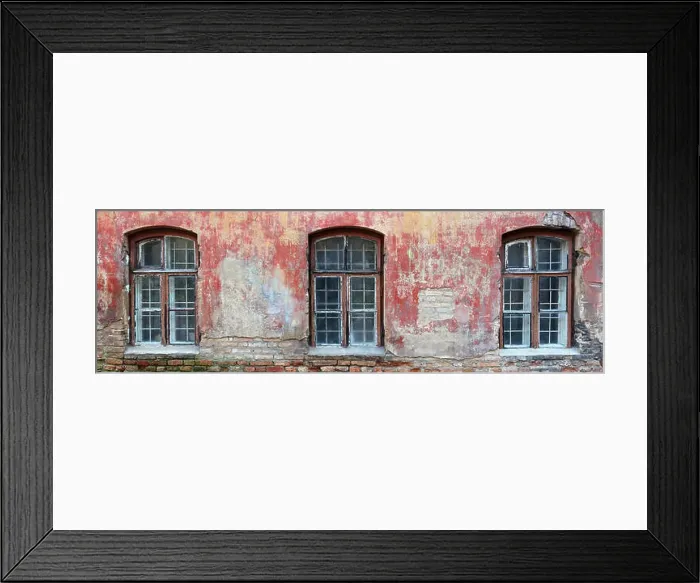 Framed Print : Three rotten curved windows in the red wall of a ruined old brick house Framed Print : Three rotten curved windows in the red wall of a ruined old brick house