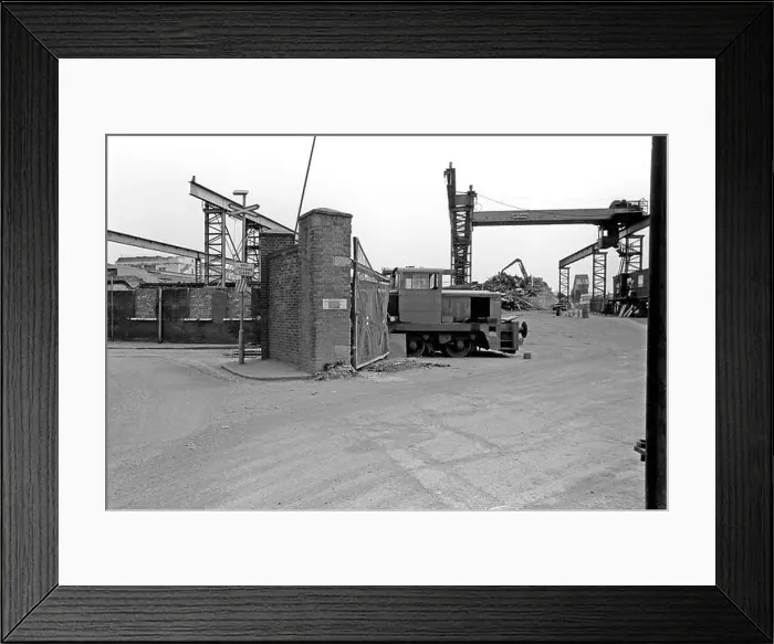 Framed Print : An industrial shunter stands at the entrance to the Ward Ferrous Metals scrapyard in Silvertown, East London Framed Print : An industrial shunter stands at the entrance to the Ward Ferrous Metals scrapyard in Silvertown, East London