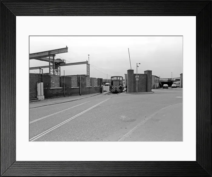 Framed Print : An industrial shunter stands at the entrance to the Ward Ferrous Metals scrapyard in Silvertown, East London