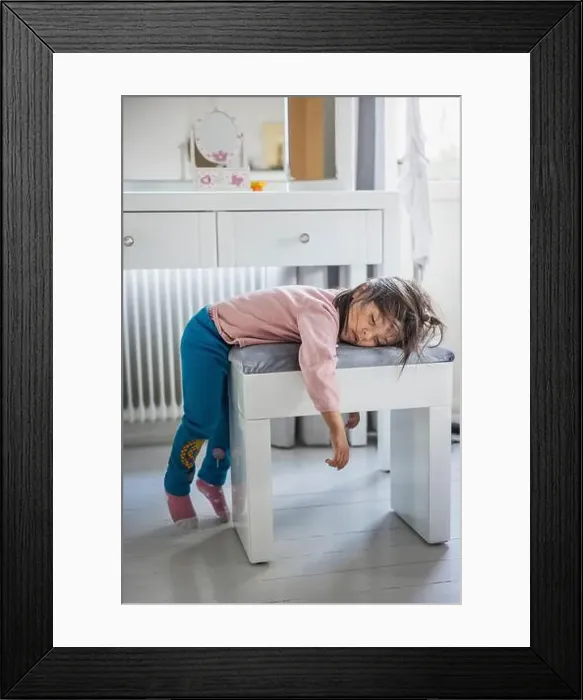Framed Print : Tired girl sleeping on stool Framed Print : Tired girl sleeping on stool