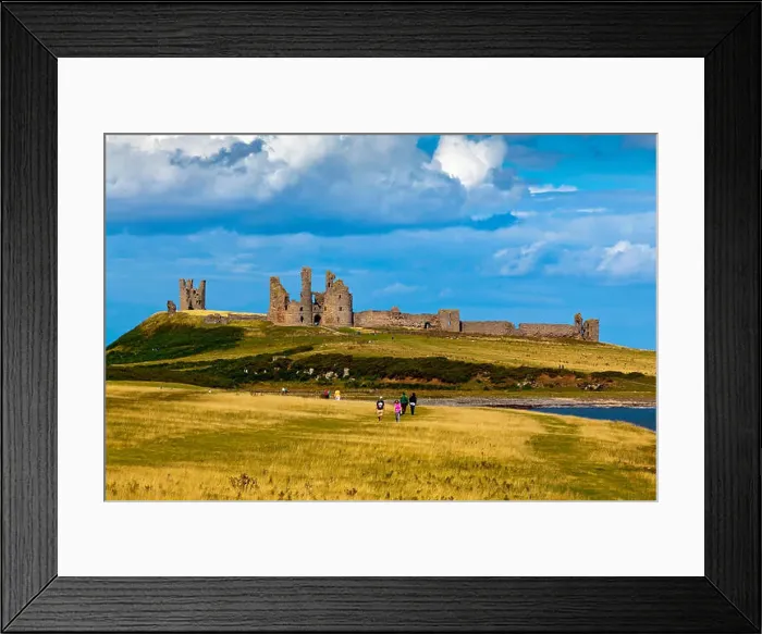 Framed Print : The ruins of Dunstanburgh Castle in Northumberland north east England UK seen from the coast path from Craster village Framed Print : The ruins of Dunstanburgh Castle in Northumberland north east England UK seen from the coast path from Craster village