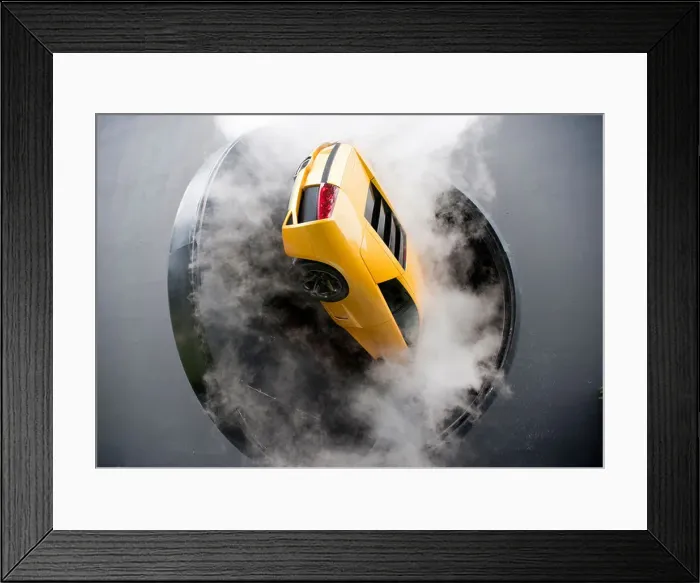 Framed Print : Lamborghini supercar on revolving door with smoke during display show at Autostadt Volkswagen car museum in Wolfsburg