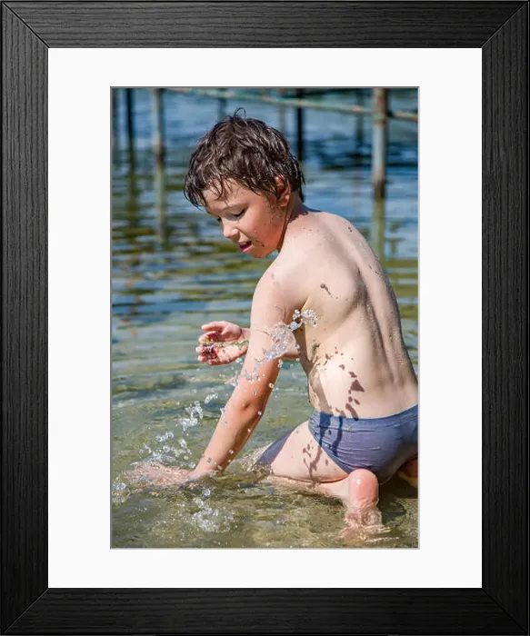 Framed Print : Boy playing with water and dirt in a polish lake Framed Print : Boy playing with water and dirt in a polish lake