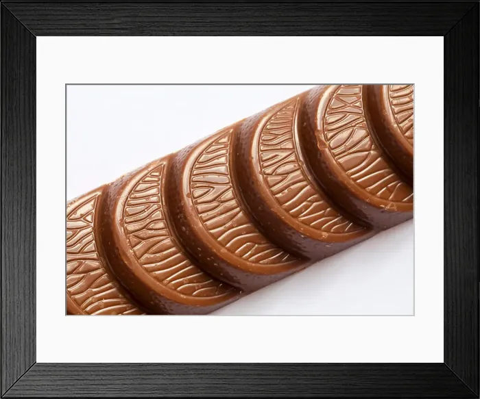Framed Print : Terry's chocolate orange milk chocolate bar made with real orange oil unwrapped close up set on white background Framed Print : Terry's chocolate orange milk chocolate bar made with real orange oil unwrapped close up set on white background