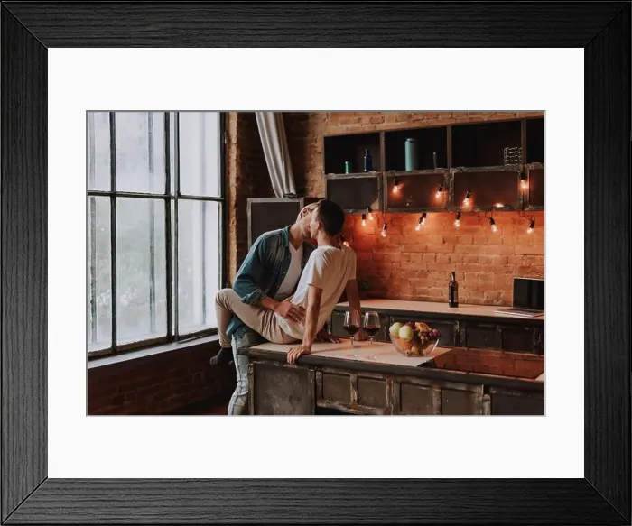 Framed Print : Loving gay couple at home. Two handsome passionate men hugging and kissing on kitchen. LGBT concept