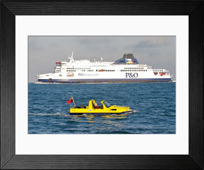 Framed Print : Tim Dutton crossing the English Channel in his Dutton Commander amphibious car with ferry in background Framed Print : Tim Dutton crossing the English Channel in his Dutton Commander amphibious car with ferry in background