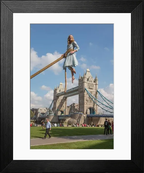 Framed Print : Aerialist Sally Miller in the character of Emma Bloom takes flight with the backdrop of the Tower Bridge to promote Framed Print : Aerialist Sally Miller in the character of Emma Bloom takes flight with the backdrop of the Tower Bridge to promote
