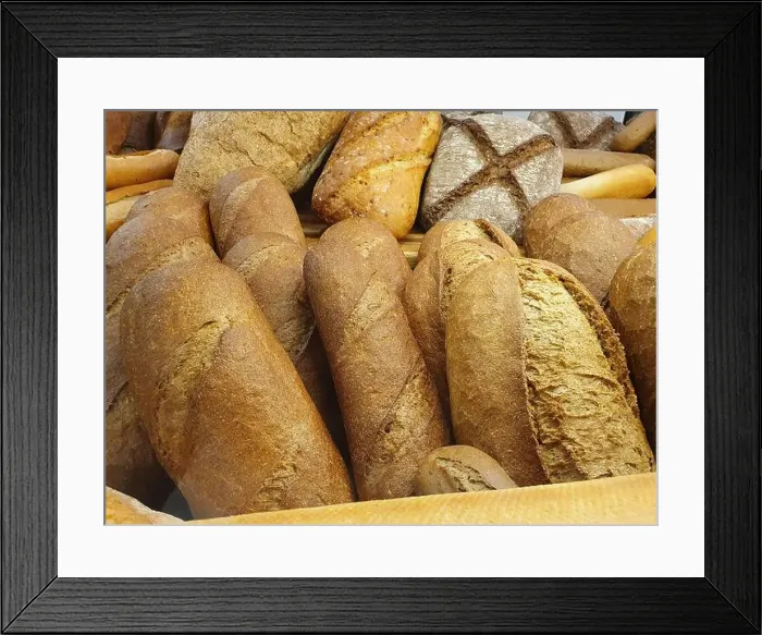 Framed Print : Delicious and fresh bread. The flavored bread is baked in the bakery and placed on the shelf for sale Framed Print : Delicious and fresh bread. The flavored bread is baked in the bakery and placed on the shelf for sale
