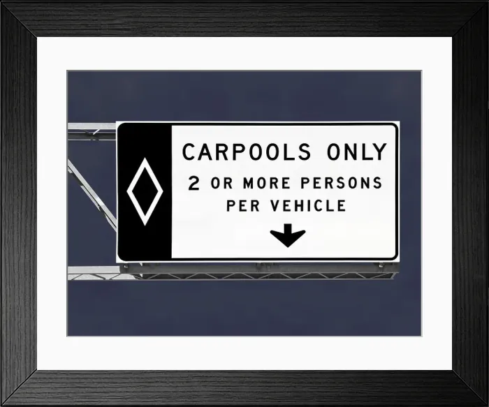 Framed Print : Overhead freeway carpool only sign with storm sky Framed Print : Overhead freeway carpool only sign with storm sky