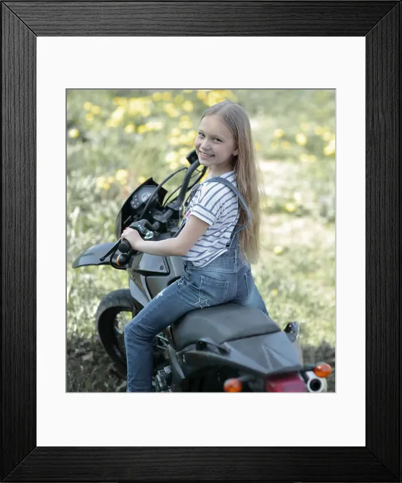 Framed Print : little biker girl riding her motorcycle Framed Print : little biker girl riding her motorcycle