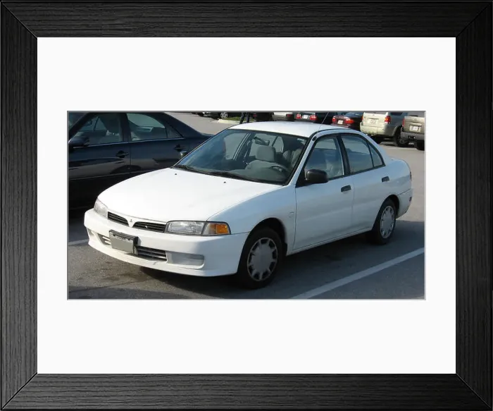 Framed Print : The Mitsubishi Mirage is a subcompact car designed for fuel efficiency and practicality Framed Print : The Mitsubishi Mirage is a subcompact car designed for fuel efficiency and practicality