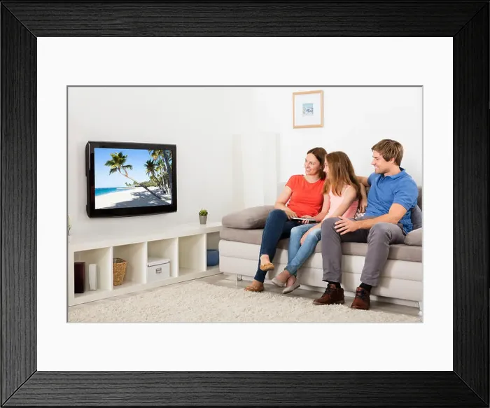 Framed Print : Happy Family Watching Television At Home Framed Print : Happy Family Watching Television At Home