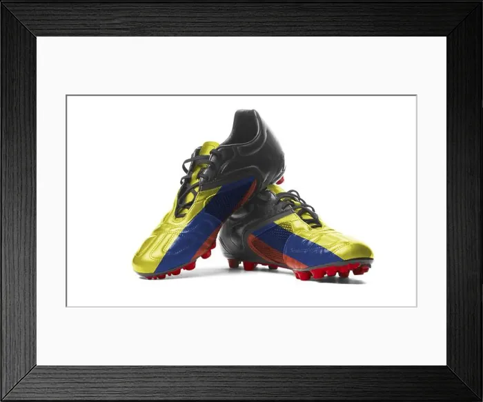 Framed Print : The Colombian flag painted on football boots. Isolated on white background Framed Print : The Colombian flag painted on football boots. Isolated on white background