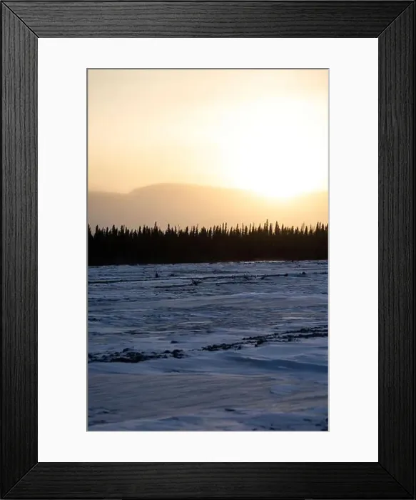 Framed Print : Sun rising over mountains behind frozen river on the winter solstice in interior Alaska Framed Print : Sun rising over mountains behind frozen river on the winter solstice in interior Alaska