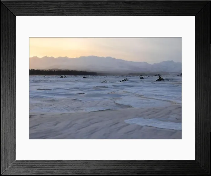 Framed Print : Sun rising over Alaska range behind a frozen river covered in snow along the Alaska Highway on the winter solstice near Framed Print : Sun rising over Alaska range behind a frozen river covered in snow along the Alaska Highway on the winter solstice near