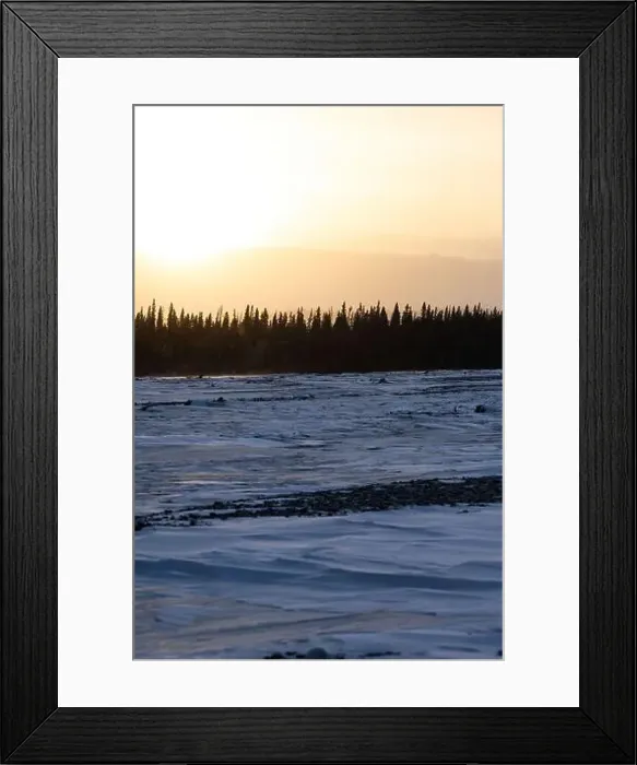 Framed Print : Sun above mountains behind a frozen river on a winter day in interior Alaska Framed Print : Sun above mountains behind a frozen river on a winter day in interior Alaska