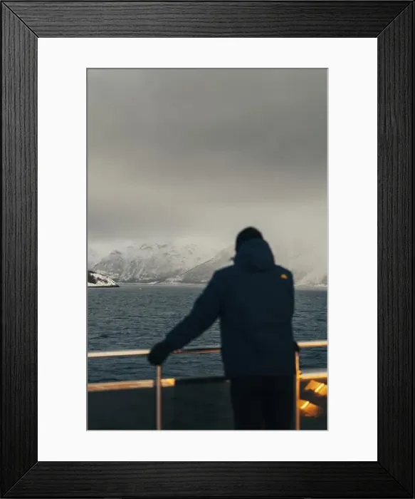 Framed Print : Man looking at the Lyngen Alps from boat in northern arctic Norway Framed Print : Man looking at the Lyngen Alps from boat in northern arctic Norway