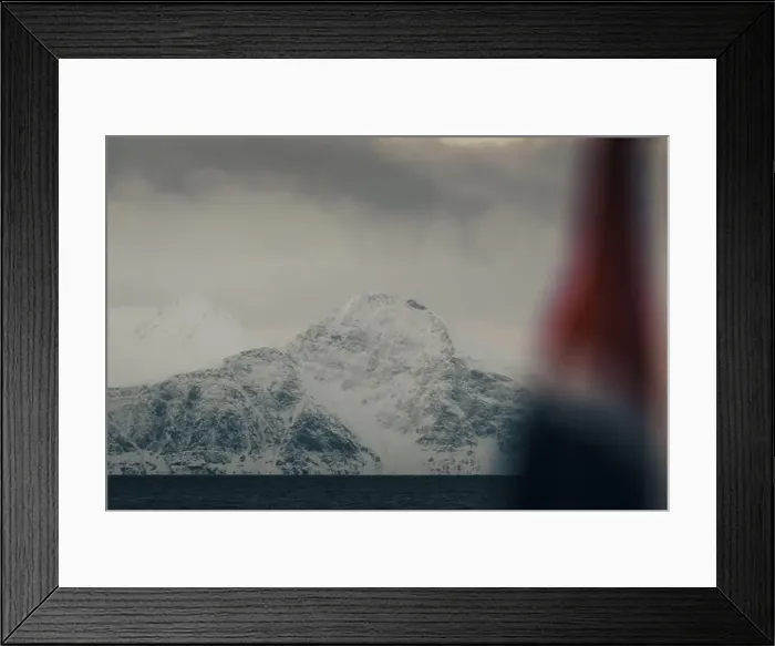 Framed Print : Snowy mountain behind Norwegian flag in the arctic Lyngen Alps in Norway Framed Print : Snowy mountain behind Norwegian flag in the arctic Lyngen Alps in Norway