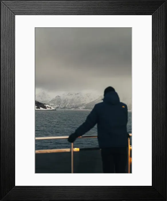 Framed Print : Man looking at snowy Lyngen Alps on overcast arctic day, northern Norway Framed Print : Man looking at snowy Lyngen Alps on overcast arctic day, northern Norway