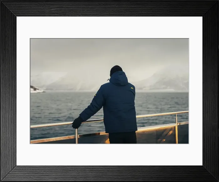 Framed Print : Man stood next to arctic tour boat railing looking at misty Lyngen Alps Framed Print : Man stood next to arctic tour boat railing looking at misty Lyngen Alps
