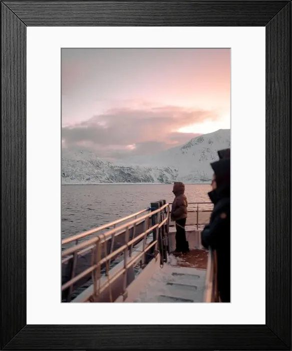 Framed Print : Woman stood on top of boat looking at sunset over the Lyngen Alps in Norway Framed Print : Woman stood on top of boat looking at sunset over the Lyngen Alps in Norway