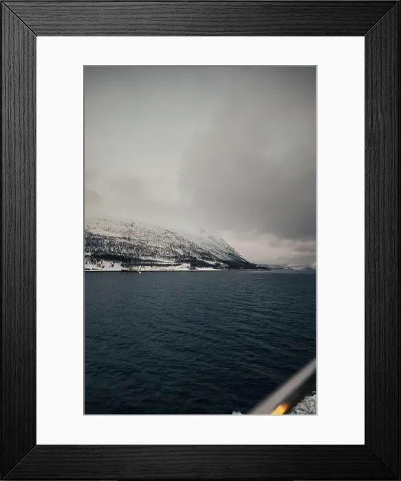 Framed Print : Snowy mountains under clouds by the arctic ocean in northern Norway in winter Framed Print : Snowy mountains under clouds by the arctic ocean in northern Norway in winter