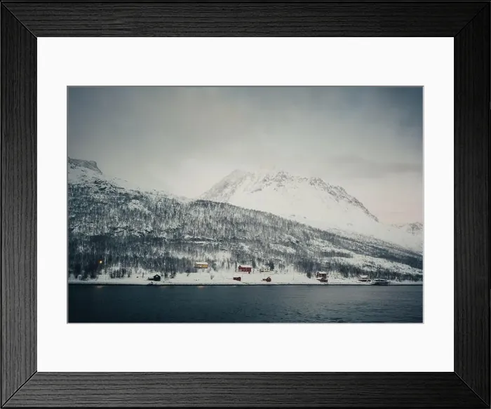 Framed Print : Wooden cabins by the arctic ocean in the Lyngen Alps in northern Norway Framed Print : Wooden cabins by the arctic ocean in the Lyngen Alps in northern Norway