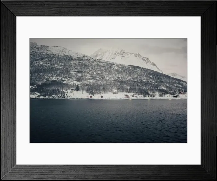 Framed Print : Cabins on snowy seafront of the Lyngen Alps in arctic Norway Framed Print : Cabins on snowy seafront of the Lyngen Alps in arctic Norway