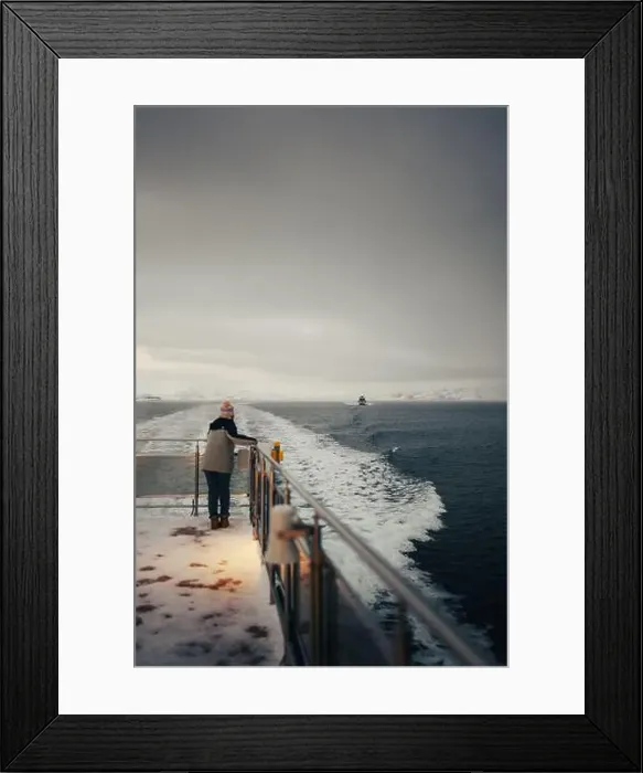 Framed Print : Woman watching boat on the arctic ocean in fjord near Tromso, Norway Framed Print : Woman watching boat on the arctic ocean in fjord near Tromso, Norway
