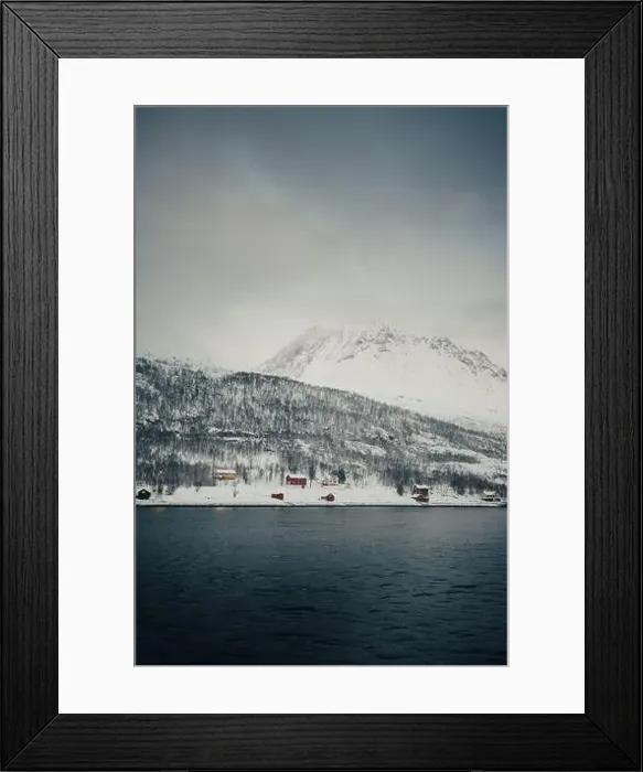 Framed Print : Cabins on the bank by the arctic ocean in the snowy Lyngen Alps in Norway Framed Print : Cabins on the bank by the arctic ocean in the snowy Lyngen Alps in Norway