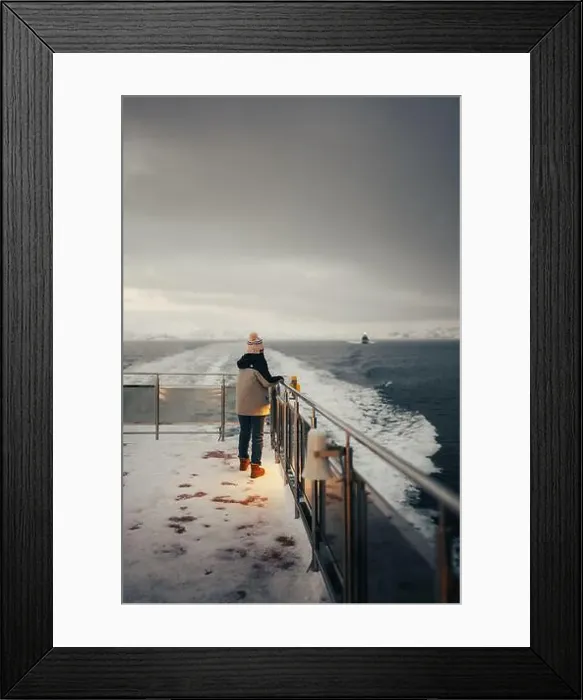 Framed Print : Woman stood on top of snowy boat holding rail in the arctic, Norway Framed Print : Woman stood on top of snowy boat holding rail in the arctic, Norway