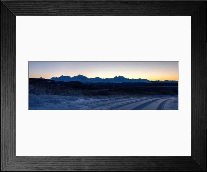 Framed Print : Orange sky behind mountain range after sunset on a snowy roadvnear Delta Junction, Alaska Framed Print : Orange sky behind mountain range after sunset on a snowy roadvnear Delta Junction, Alaska