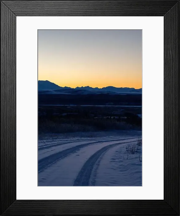 Framed Print : Orange sky behind mountains after sunset on a snowy roadvnear Delta Junction, Alaska Framed Print : Orange sky behind mountains after sunset on a snowy roadvnear Delta Junction, Alaska