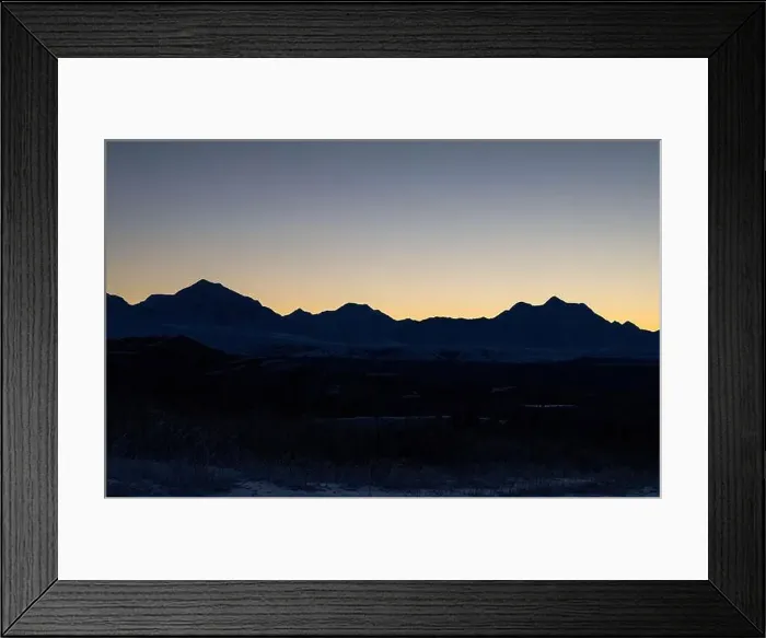 Framed Print : Orange sky behind mountains after sunset on a winter evening near Delta Junction, Alaska Framed Print : Orange sky behind mountains after sunset on a winter evening near Delta Junction, Alaska