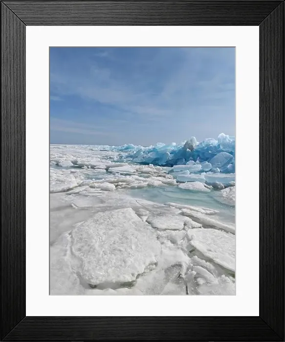 Framed Print : Vast icy terrain features large blue icebergs and melting ice sheets reflecting the tranquil arctic environment Framed Print : Vast icy terrain features large blue icebergs and melting ice sheets reflecting the tranquil arctic environment
