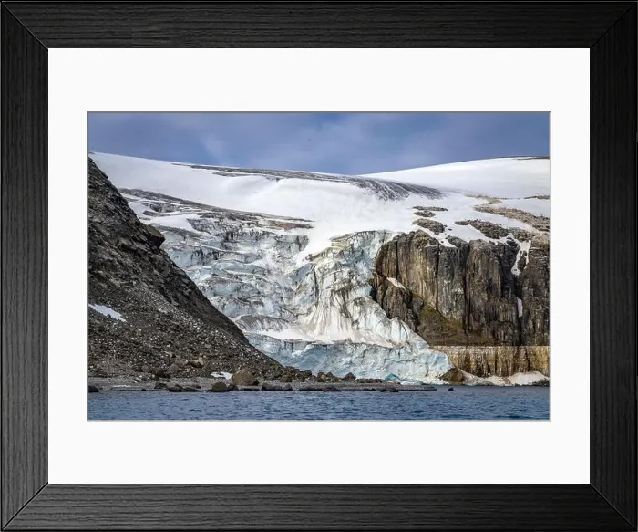 Framed Print : rocks waterfall small iceberg and glacier at the Alkefjellet between Spitsbergen and Nordaustlandet on Svalbard, Norway Framed Print : rocks waterfall small iceberg and glacier at the Alkefjellet between Spitsbergen and Nordaustlandet on Svalbard, Norway
