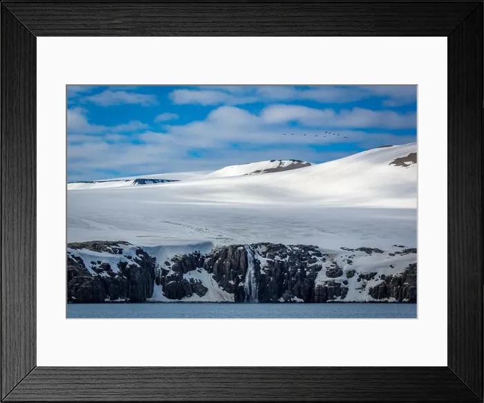 Framed Print : rocks waterfall small iceberg and glacier at the Alkefjellet between Spitsbergen and Nordaustlandet on Svalbard, Norway Framed Print : rocks waterfall small iceberg and glacier at the Alkefjellet between Spitsbergen and Nordaustlandet on Svalbard, Norway