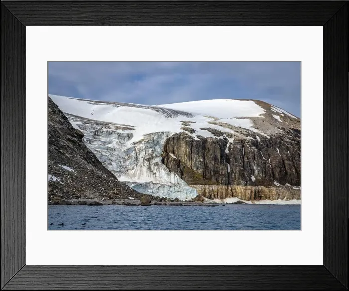 Framed Print : rocks waterfall small iceberg and glacier at the Alkefjellet between Spitsbergen and Nordaustlandet on Svalbard, Norway Framed Print : rocks waterfall small iceberg and glacier at the Alkefjellet between Spitsbergen and Nordaustlandet on Svalbard, Norway