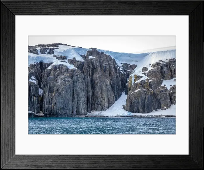 Framed Print : rocks waterfall small icebergs at the Alkefjellet between Spitsbergen and Nordaustlandet on Svalbard, Norway Framed Print : rocks waterfall small icebergs at the Alkefjellet between Spitsbergen and Nordaustlandet on Svalbard, Norway
