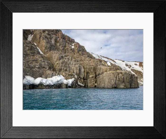 Framed Print : rocks waterfall small icebergs at the Alkefjellet between Spitsbergen and Nordaustlandet on Svalbard, Norway Framed Print : rocks waterfall small icebergs at the Alkefjellet between Spitsbergen and Nordaustlandet on Svalbard, Norway