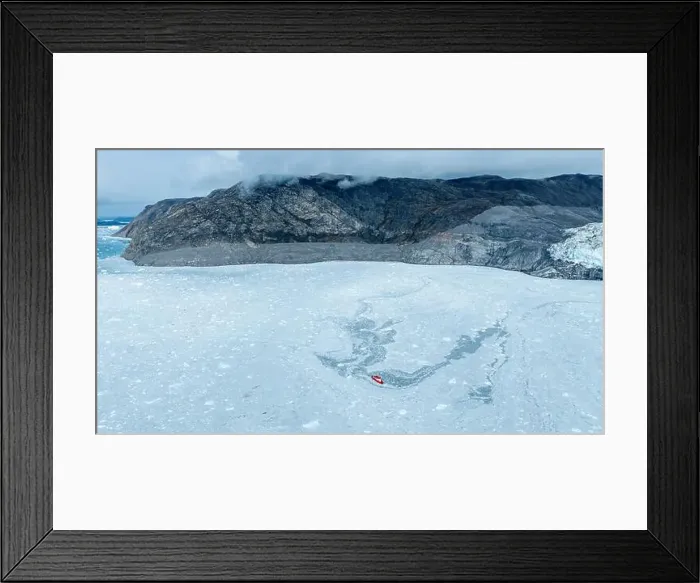 Framed Print : Aerial of a little ship floating between the ice below the Eqi glacier, Western Greenland, Denmark, Polar Regions Framed Print : Aerial of a little ship floating between the ice below the Eqi glacier, Western Greenland, Denmark, Polar Regions